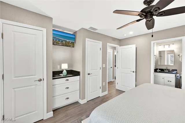 a bedroom with a bed and a dresser