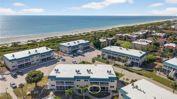an aerial view of a house with a ocean view