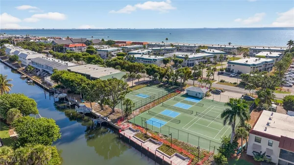an aerial view of residential houses with outdoor space