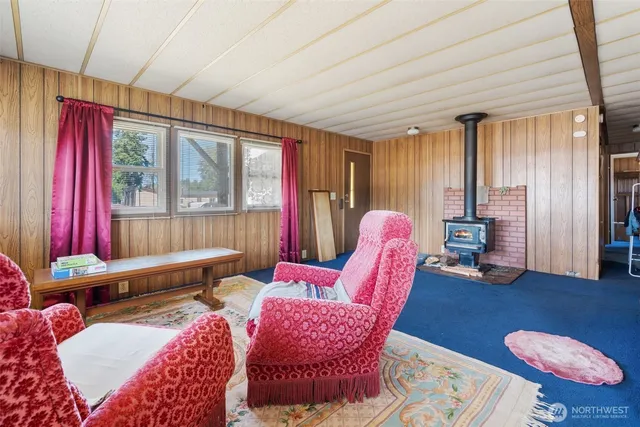 a bedroom with furniture and a wooden floor