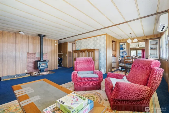 a bedroom with furniture and wooden floor
