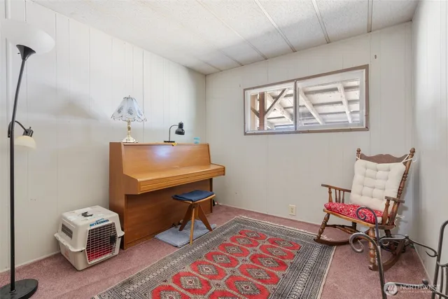 a room with furniture and gym equipment