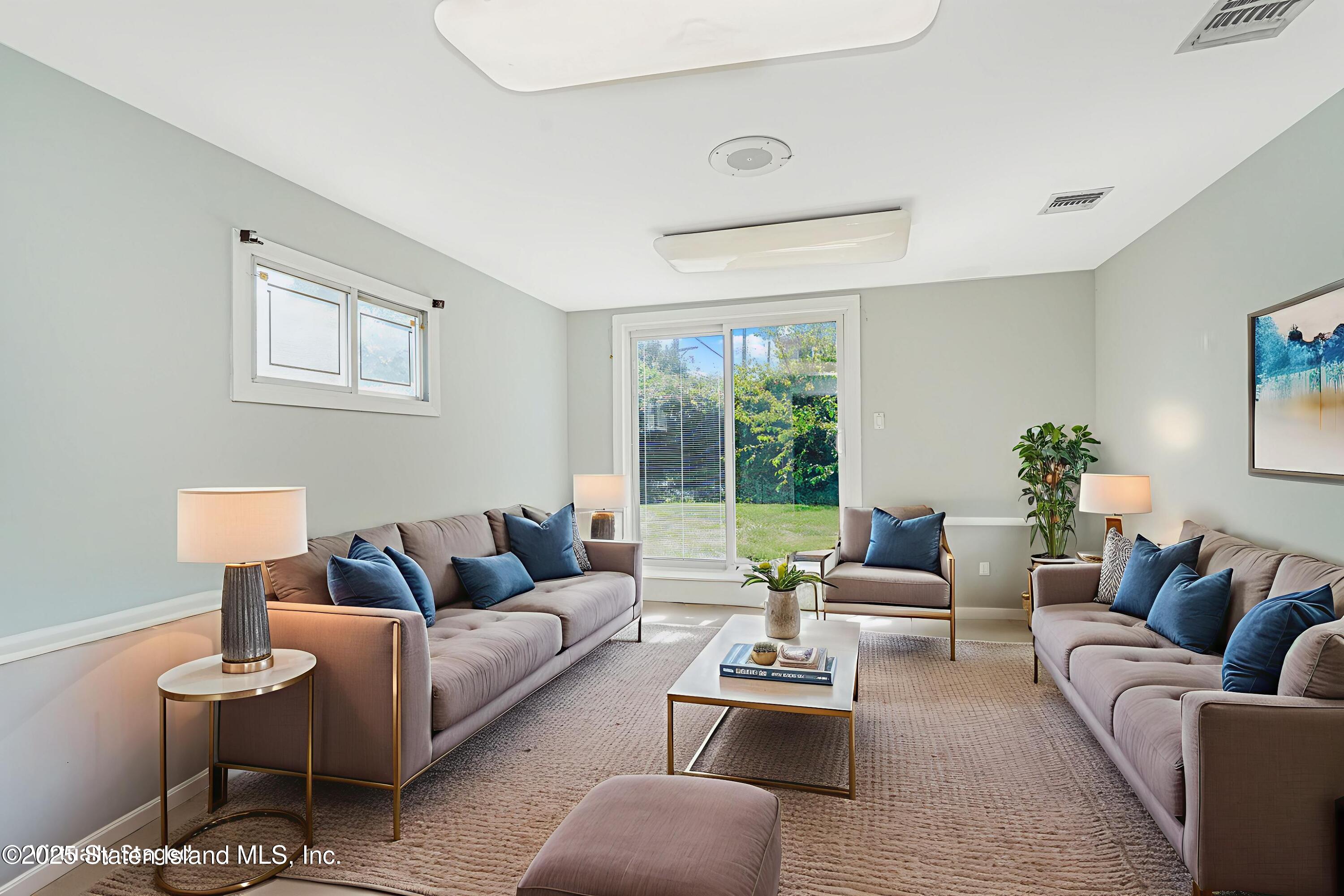 622 Barlow Avenue Staten Island, NY 10312 - Photo 14 of 27 a living room with furniture and a large window