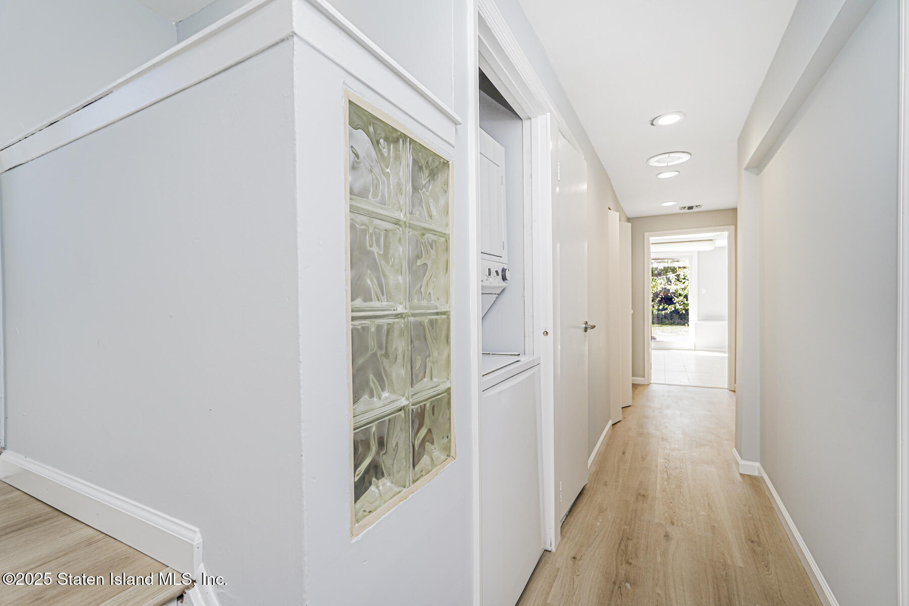 622 Barlow Avenue Staten Island, NY 10312 - Photo 17 of 27 a view of a hallway with wooden floor and a bathroom