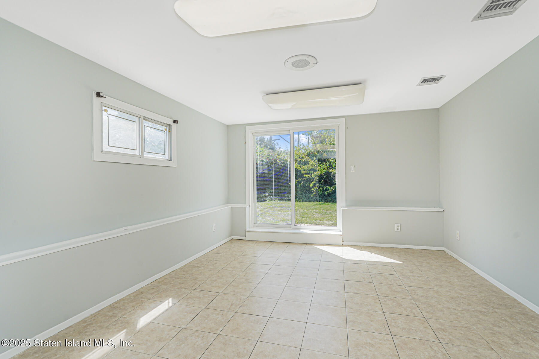 622 Barlow Avenue Staten Island, NY 10312 - Photo 18 of 27 a view of an empty room with a window