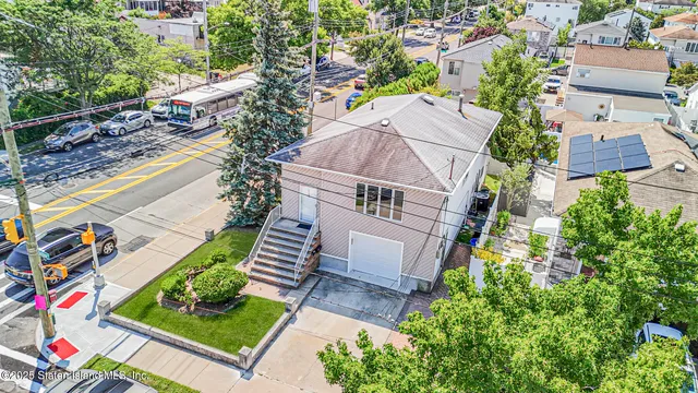 an aerial view of a house with a garden