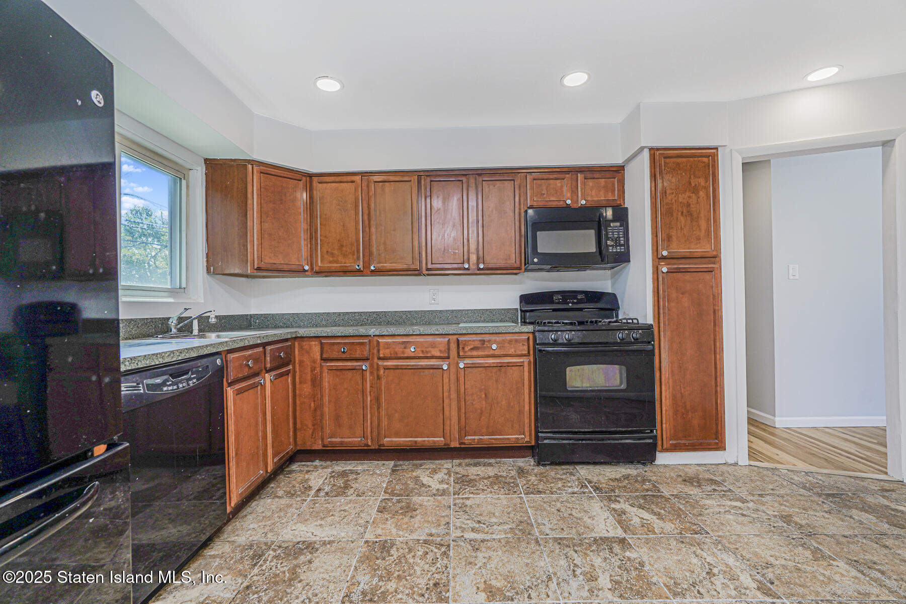 622 Barlow Avenue Staten Island, NY 10312 - Photo 5 of 27 a kitchen with granite countertop a stove top oven sink and cabinets
