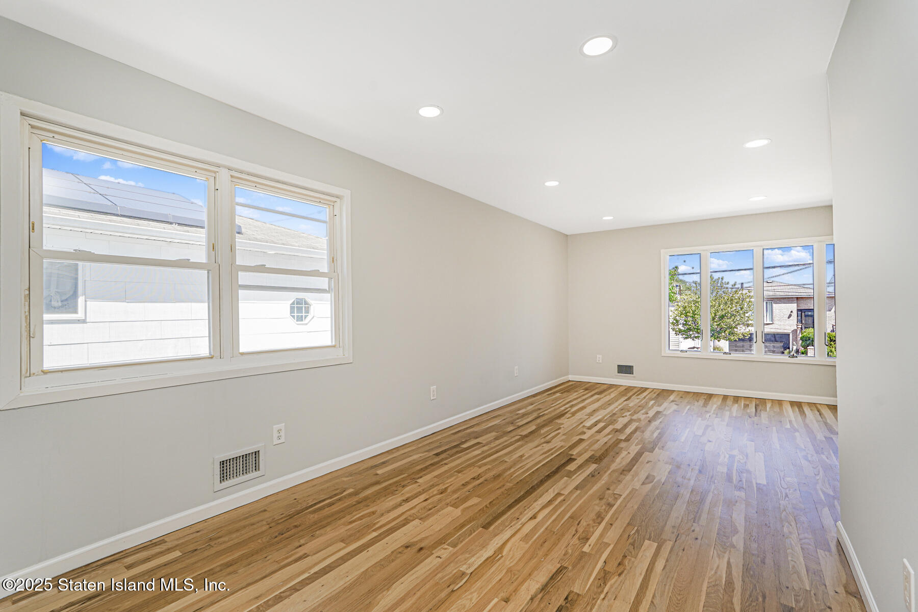 622 Barlow Avenue Staten Island, NY 10312 - Photo 8 of 27 wooden floor in an empty room with a window