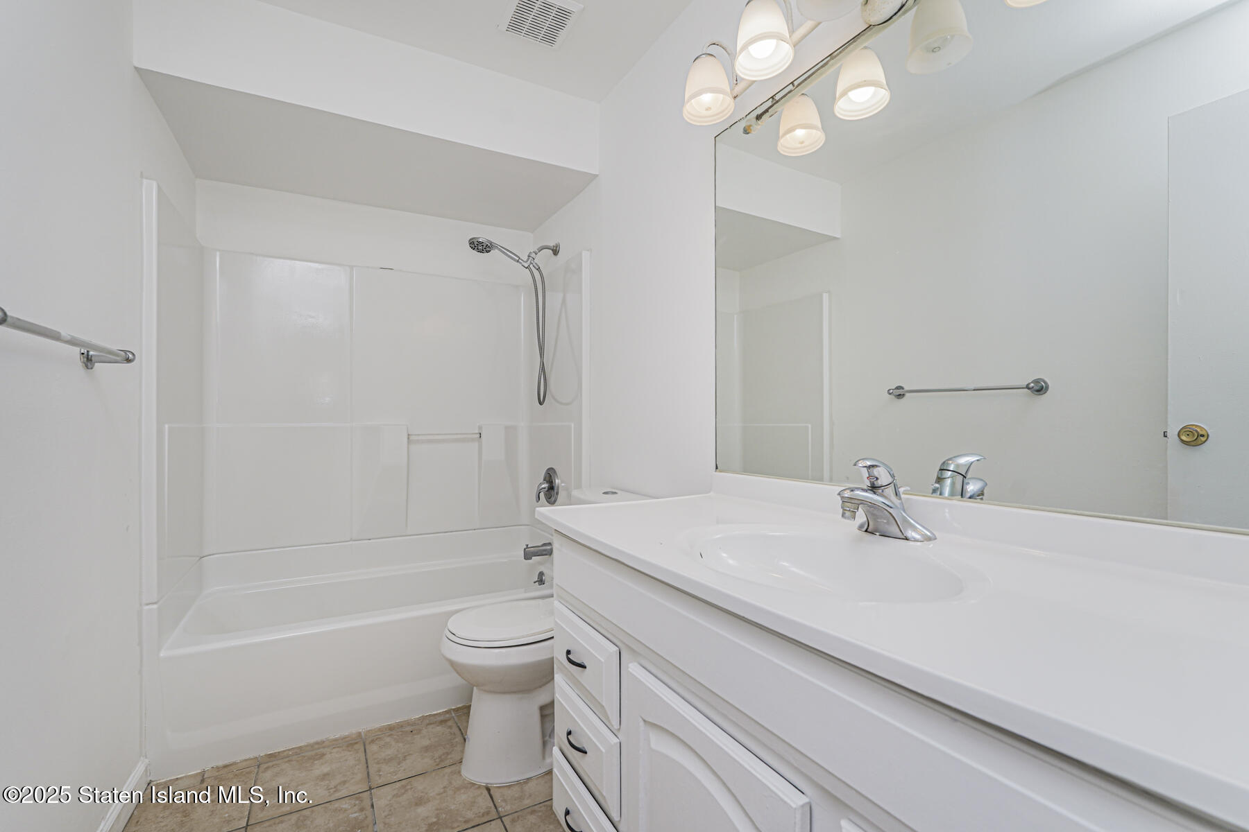 622 Barlow Avenue Staten Island, NY 10312 - Photo 10 of 27 a bathroom with a sink a toilet and shower