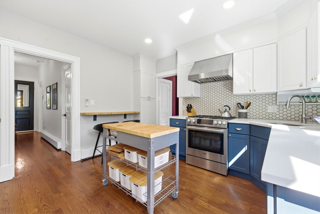 101 Forbes Street Boston, MA 02130 - Photo 16 of 38 a kitchen with a stove and a sink