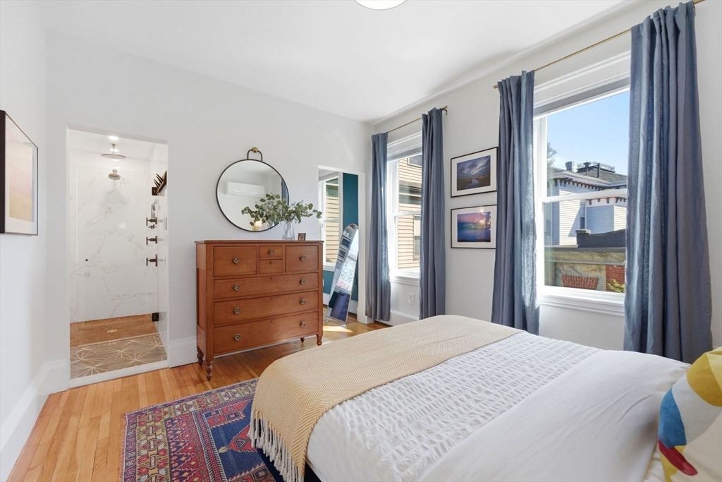 101 Forbes Street Boston, MA 02130 - Photo 22 of 38 a bedroom with a bed and a dresser