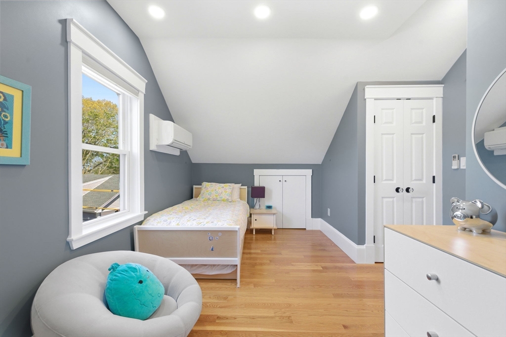 101 Forbes Street Boston, MA 02130 - Photo 34 of 38 a room with wooden floor and window