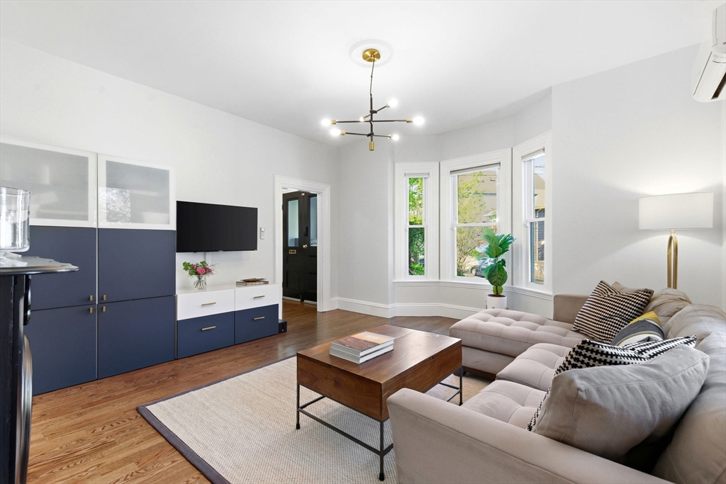 101 Forbes Street Boston, MA 02130 - Photo 6 of 38 a living room with furniture and a flat screen tv