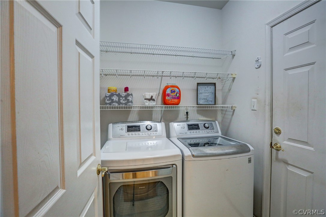 2232 Waters Mill Circle Richmond, VA 23235 - Photo 19 of 35 Laundry Room with shelving and Washer and Dryer Co