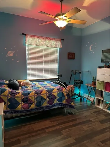 a bedroom with bed and window