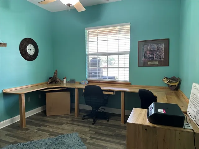 a work room with furniture and a window