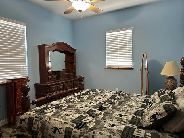 a bedroom with a bed and a dresser in it