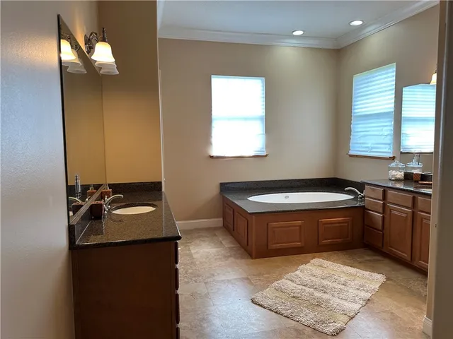 a kitchen with sink stove and refrigerator