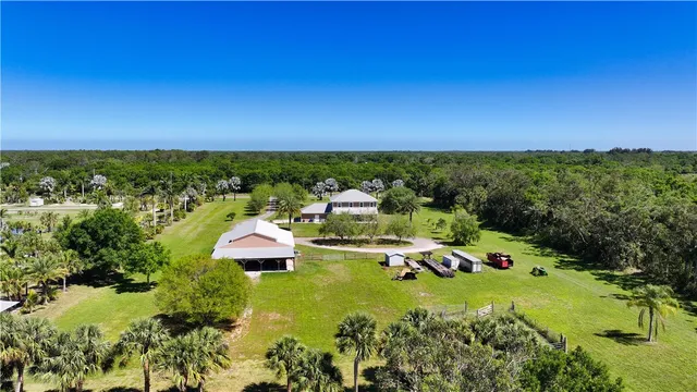 an aerial view of a residential apartment building with a yard