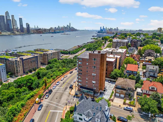 a kitchen with wooden floors and white cabinets