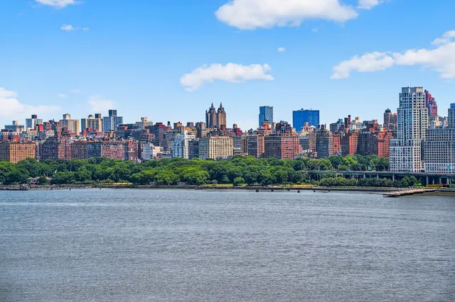 a view of balcony with floor to ceiling windows and wooden floor