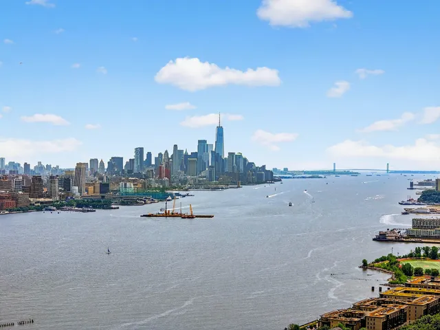 a view of a street with a building in the background