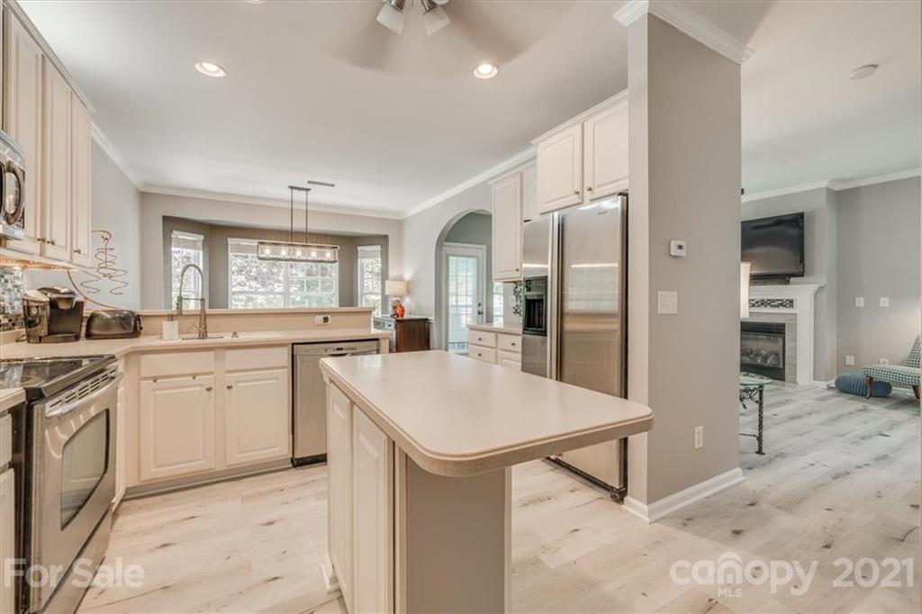 138 Whitley Mills Road Fort Mill, SC 29708 - Photo 18 of 38 a kitchen with white cabinets and refrigerator