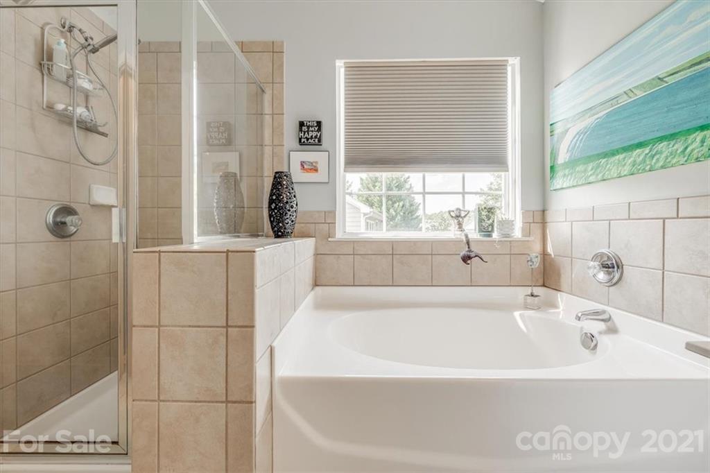 138 Whitley Mills Road Fort Mill, SC 29708 - Photo 20 of 38 a bathroom with a bathtub and shower