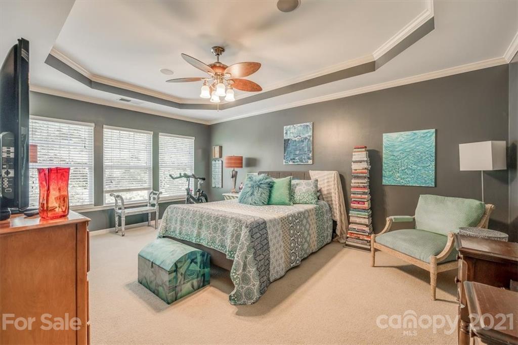 138 Whitley Mills Road Fort Mill, SC 29708 - Photo 24 of 38 a spacious bedroom with a bed couch and a large window
