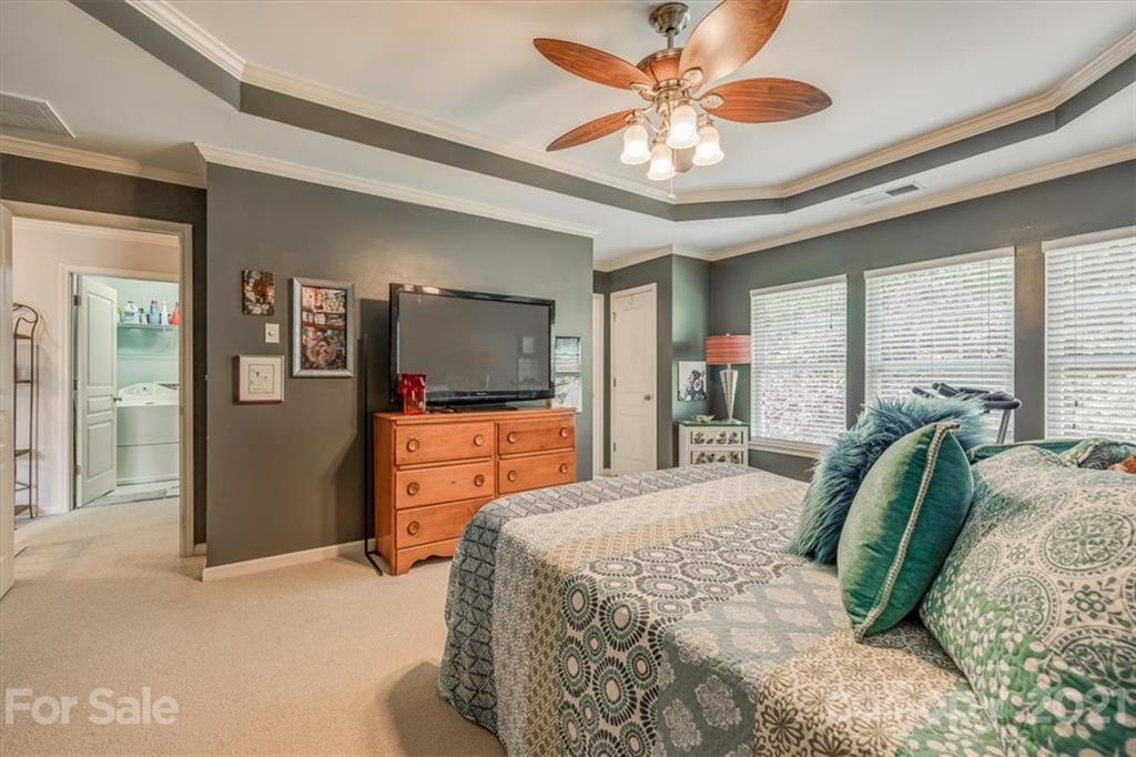 138 Whitley Mills Road Fort Mill, SC 29708 - Photo 26 of 38 a bedroom with a bed a large window and flat screen television