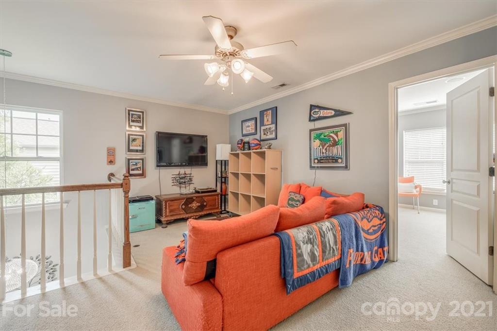 138 Whitley Mills Road Fort Mill, SC 29708 - Photo 30 of 38 a bedroom with furniture and a flat screen tv