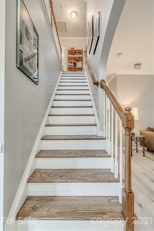 138 Whitley Mills Road Fort Mill, SC 29708 - Photo 4 of 38 a view of staircase with lots of frames on wall and windows