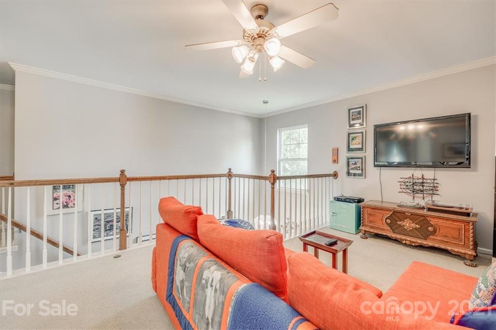 138 Whitley Mills Road Fort Mill, SC 29708 - Photo 31 of 38 a living room with furniture and a flat screen tv
