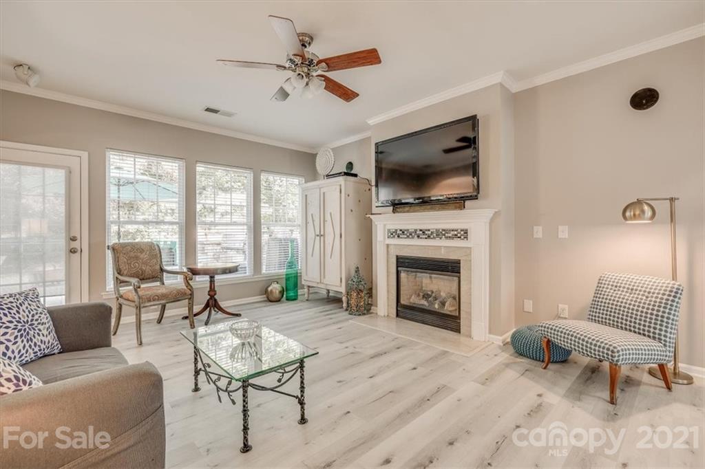 138 Whitley Mills Road Fort Mill, SC 29708 - Photo 6 of 38 a living room with furniture a flat screen tv and a fireplace