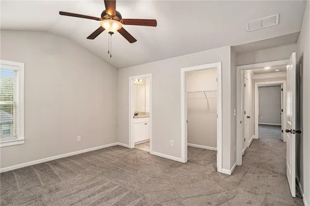a view of hallway with a window and stairs