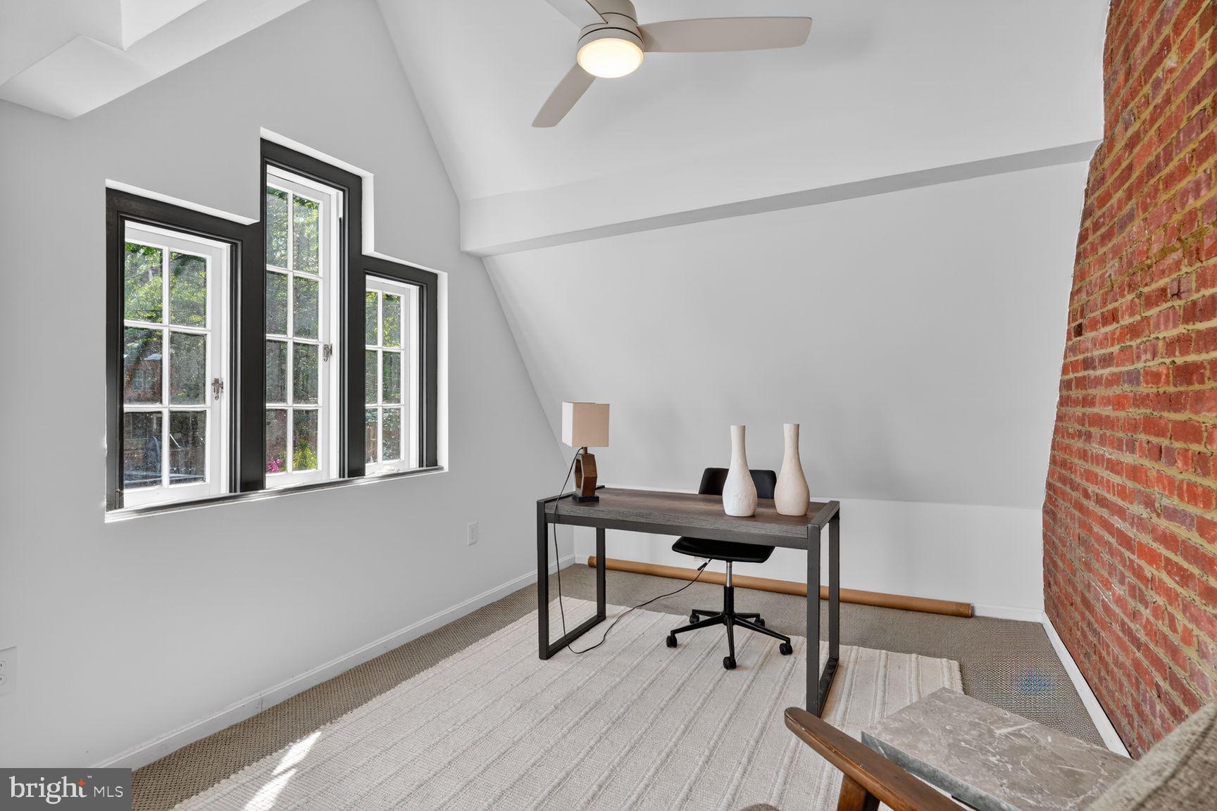 1616 44th Street Northwest Washington, DC 20007 - Photo 24 of 51 a view of a workspace with furniture and a window