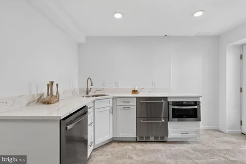 a kitchen with a sink and cabinets
