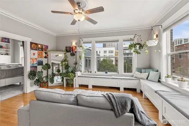 a living room with furniture and a large window