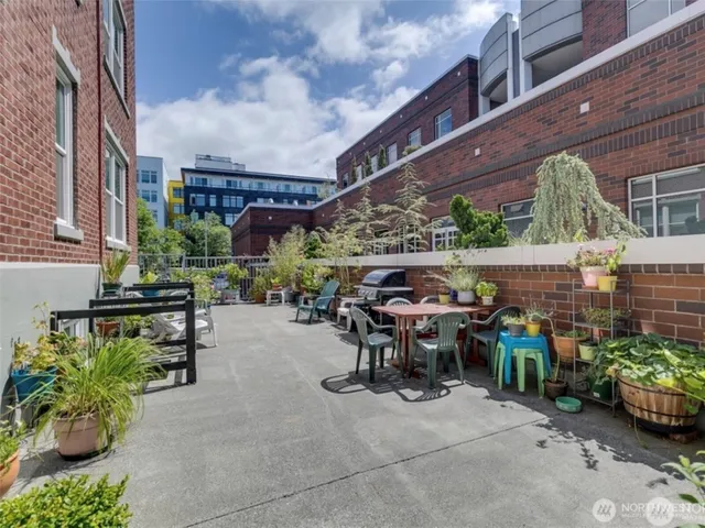 a view of a chairs and table in a patio
