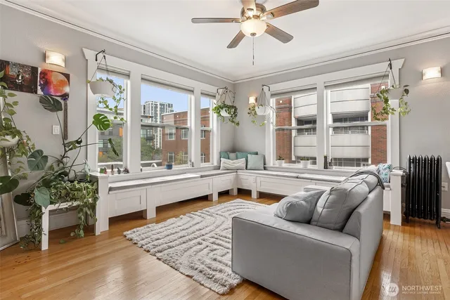a living room with furniture and a large window