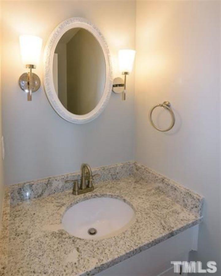 3148 Morningside Drive Raleigh, NC 27607 - Photo 12 of 24 a bathroom with a sink and mirror