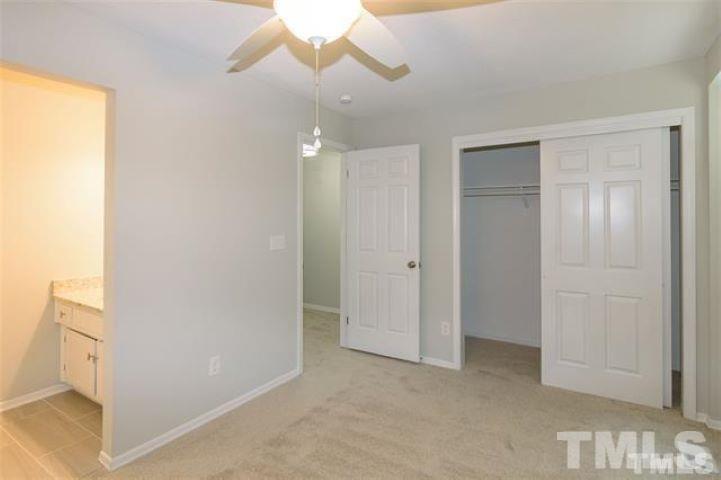3148 Morningside Drive Raleigh, NC 27607 - Photo 19 of 24 a view of an empty room and chandelier fan