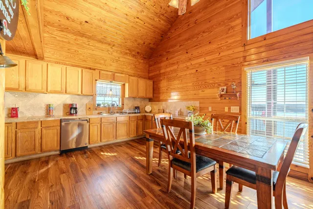a kitchen with a sink cabinets and window