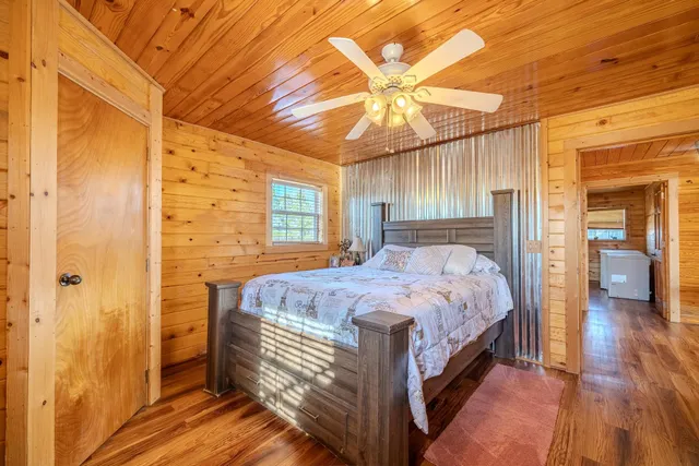 a bed room with a bed and a chandelier