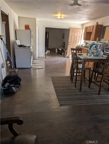 a view of a livingroom with furniture and a flat screen tv