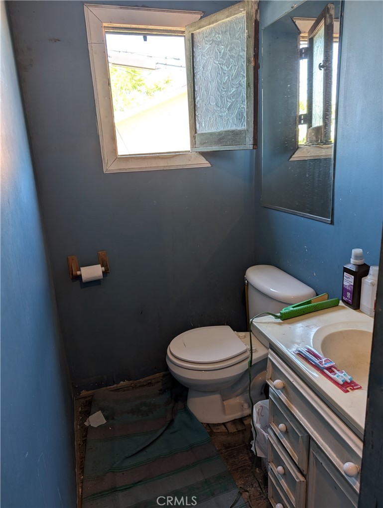 1071 Center Street Riverside, CA 92507 - Photo 19 of 24 a white toilet sitting next to a bathroom sink