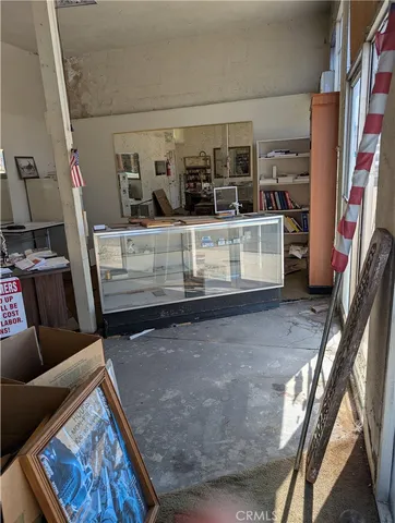 a view of livingroom with furniture and workspace