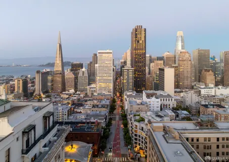 a bathroom with a sink toilet and mirror