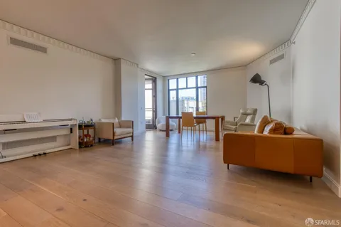 a view with granite countertop a sink and a mirror