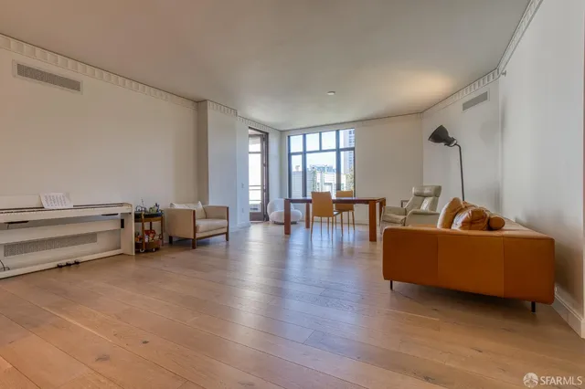 a view with granite countertop a sink and a mirror
